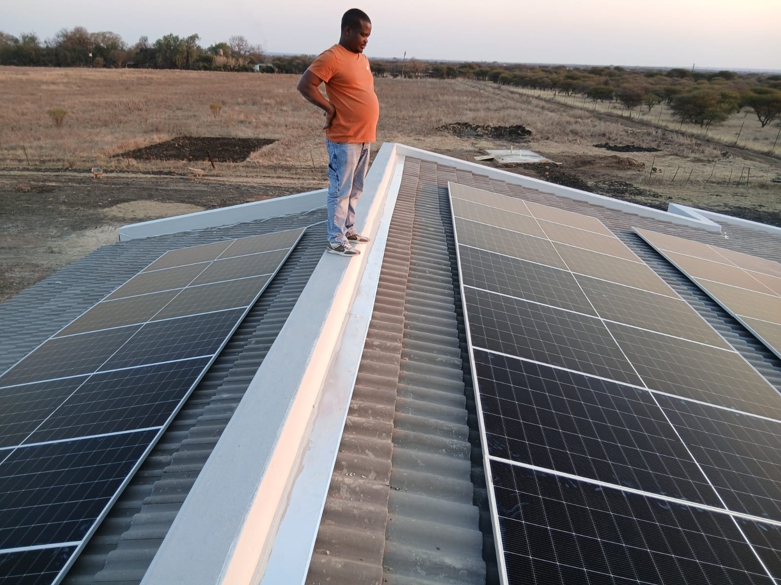 Bravo Electrical team installing rooftop solar panels